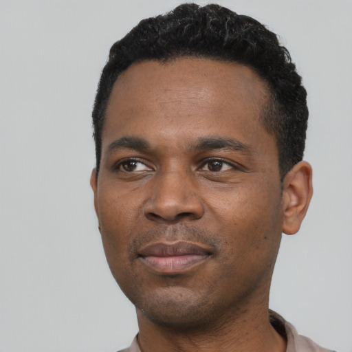 Neutral black young-adult male with short  black hair and brown eyes