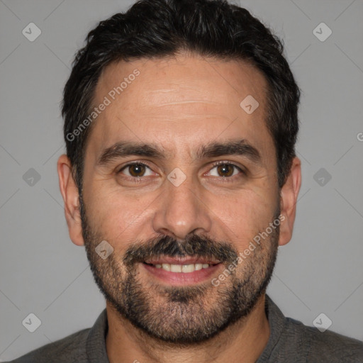 Joyful white adult male with short  black hair and brown eyes