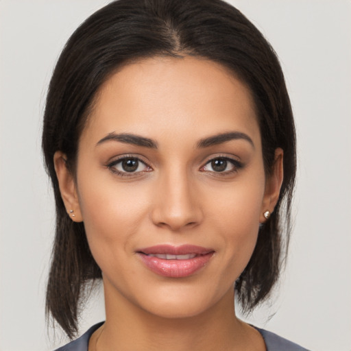 Joyful white young-adult female with medium  brown hair and brown eyes