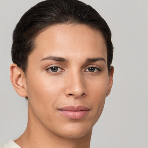 Joyful white young-adult female with short  brown hair and brown eyes