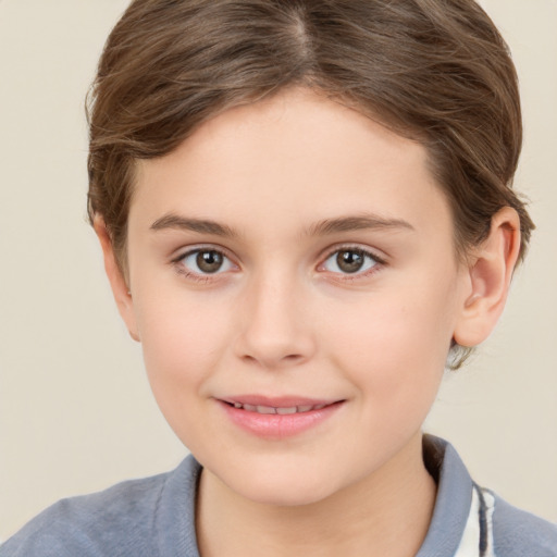 Joyful white child female with short  brown hair and brown eyes