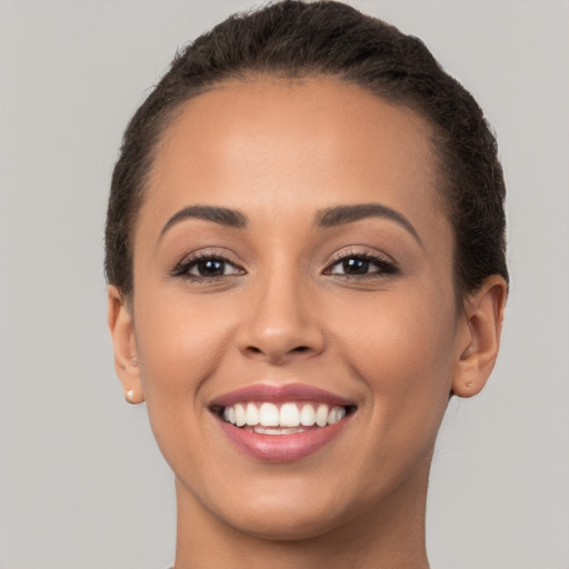 Joyful white young-adult female with long  brown hair and brown eyes