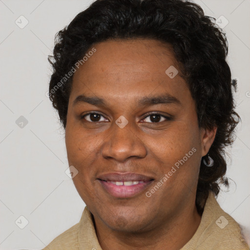 Joyful black young-adult male with short  brown hair and brown eyes