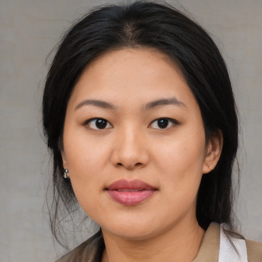 Joyful asian young-adult female with medium  black hair and brown eyes