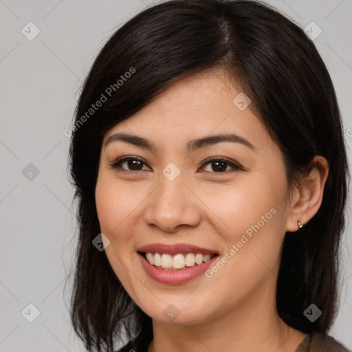 Joyful asian young-adult female with long  brown hair and brown eyes