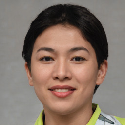 Joyful asian young-adult female with short  brown hair and brown eyes