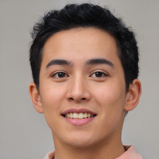 Joyful asian young-adult male with short  brown hair and brown eyes