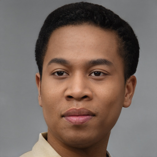 Joyful black young-adult male with short  black hair and brown eyes