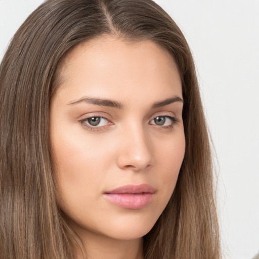 Neutral white young-adult female with long  brown hair and brown eyes