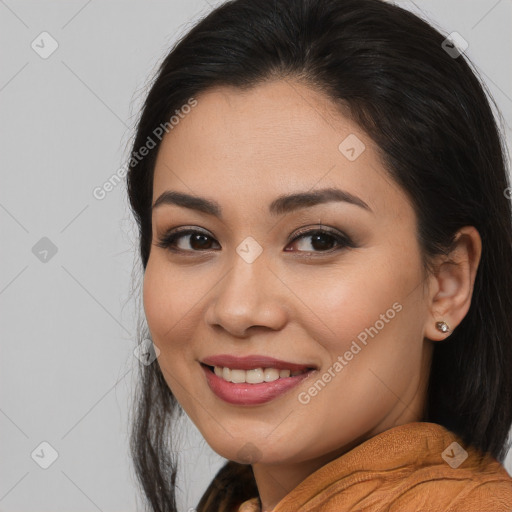 Joyful latino young-adult female with medium  brown hair and brown eyes