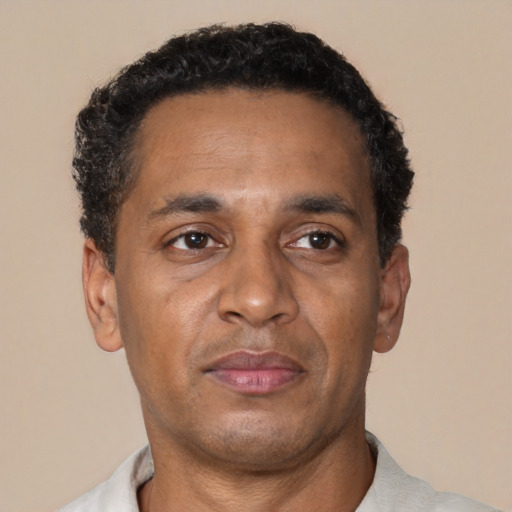 Neutral black adult male with short  brown hair and brown eyes