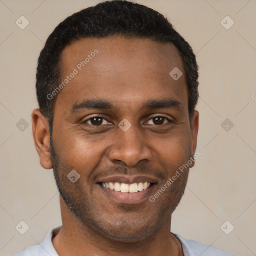 Joyful black young-adult male with short  black hair and brown eyes