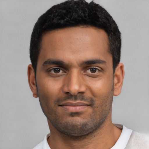 Neutral black young-adult male with short  black hair and brown eyes