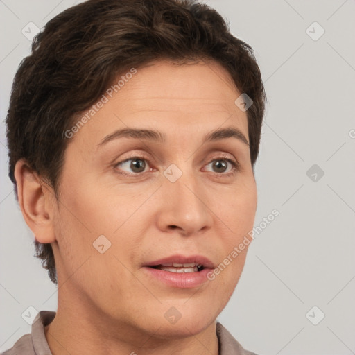 Joyful white adult female with short  brown hair and brown eyes