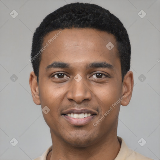 Joyful black young-adult male with short  black hair and brown eyes