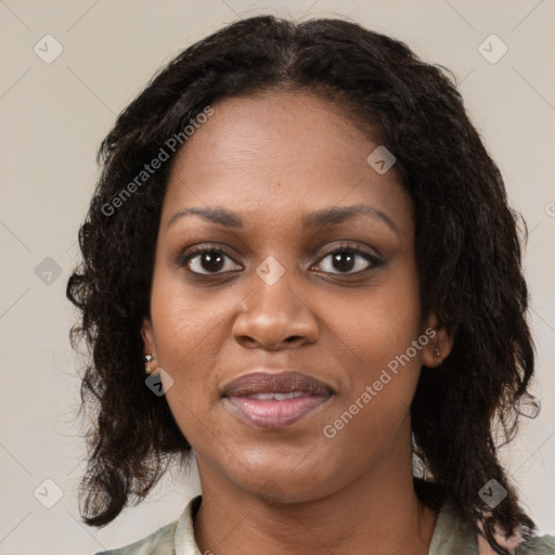 Joyful black young-adult female with medium  brown hair and brown eyes