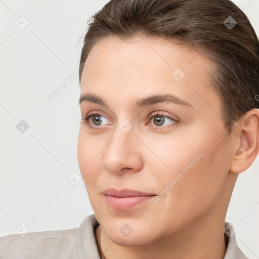 Joyful white young-adult female with short  brown hair and brown eyes