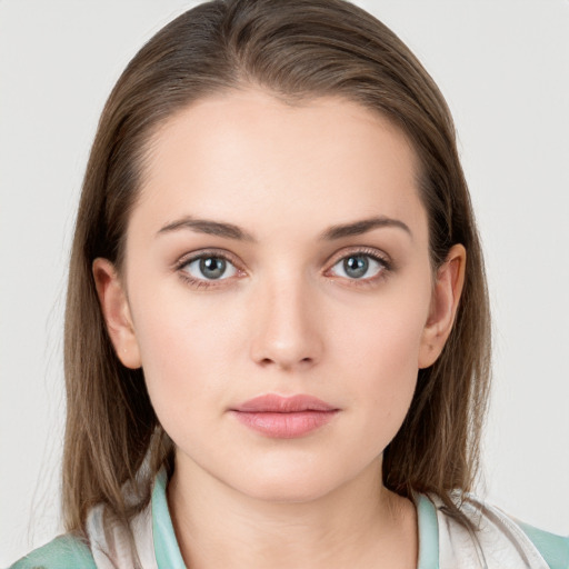 Neutral white young-adult female with medium  brown hair and grey eyes