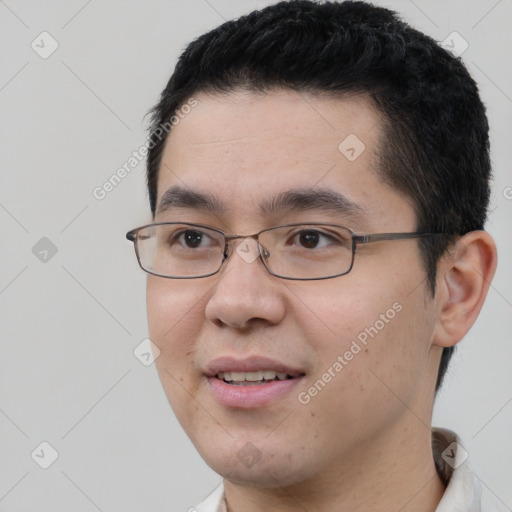 Joyful white young-adult male with short  black hair and brown eyes