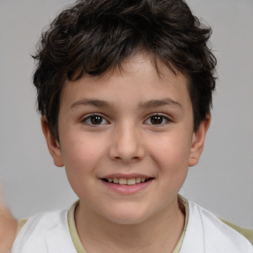 Joyful white child male with short  brown hair and brown eyes