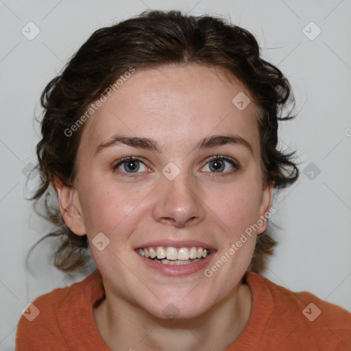 Joyful white young-adult female with medium  brown hair and blue eyes