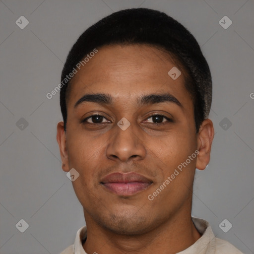 Joyful black young-adult male with short  black hair and brown eyes