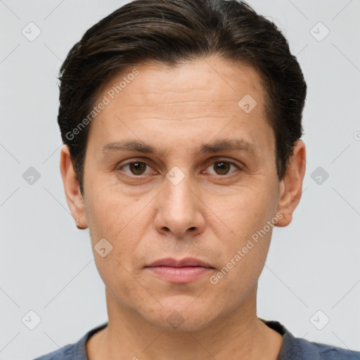 Joyful white adult male with short  brown hair and brown eyes