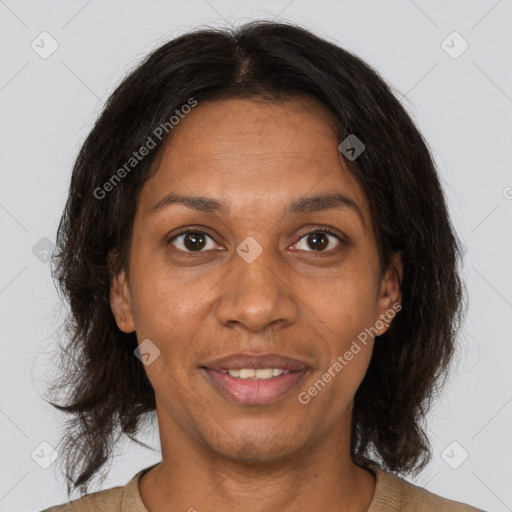 Joyful black adult female with medium  brown hair and brown eyes