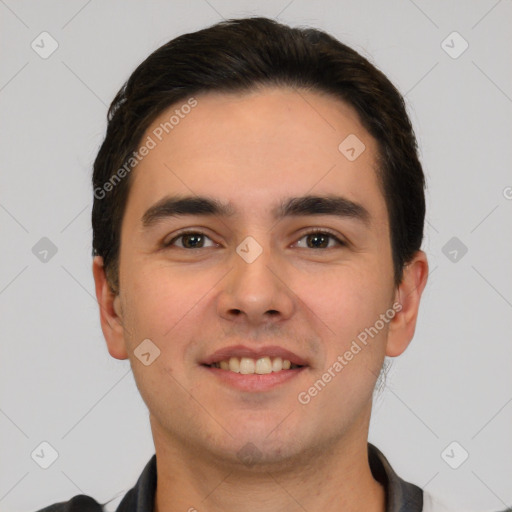 Joyful white young-adult male with short  black hair and brown eyes