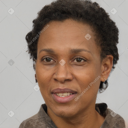 Joyful black adult female with short  brown hair and brown eyes