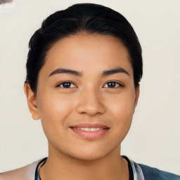 Joyful latino young-adult female with short  black hair and brown eyes