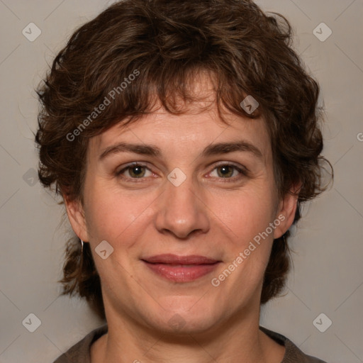 Joyful white adult female with medium  brown hair and grey eyes