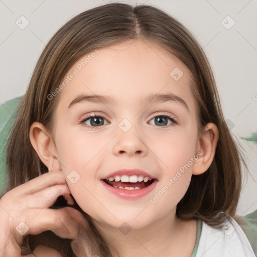 Joyful white child female with medium  brown hair and brown eyes