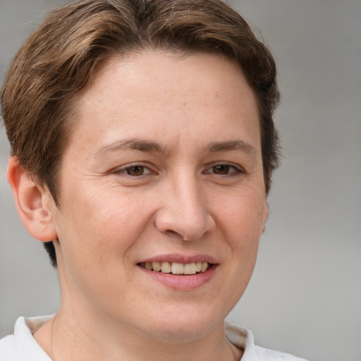 Joyful white adult female with short  brown hair and brown eyes