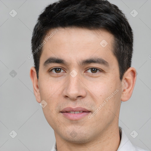 Joyful white young-adult male with short  black hair and brown eyes