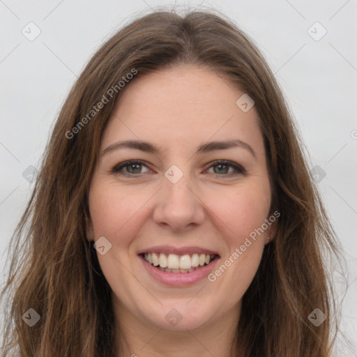 Joyful white young-adult female with long  brown hair and green eyes