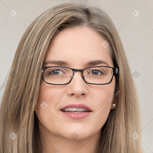 Joyful white young-adult female with long  brown hair and green eyes