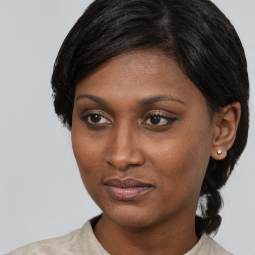 Joyful latino young-adult female with medium  black hair and brown eyes