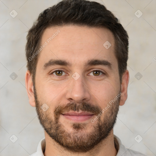 Joyful white adult male with short  brown hair and brown eyes