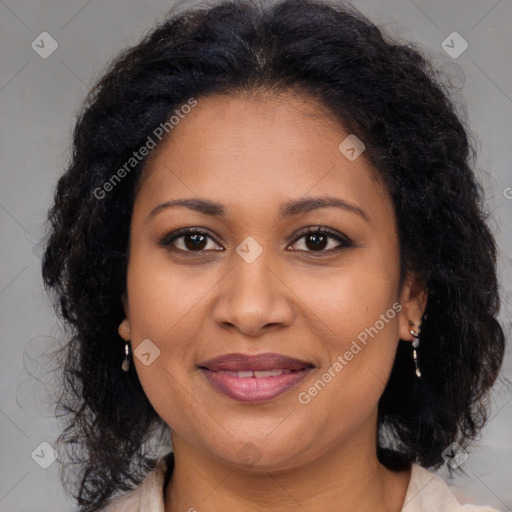 Joyful black adult female with medium  brown hair and brown eyes