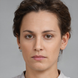 Neutral white young-adult female with short  brown hair and brown eyes