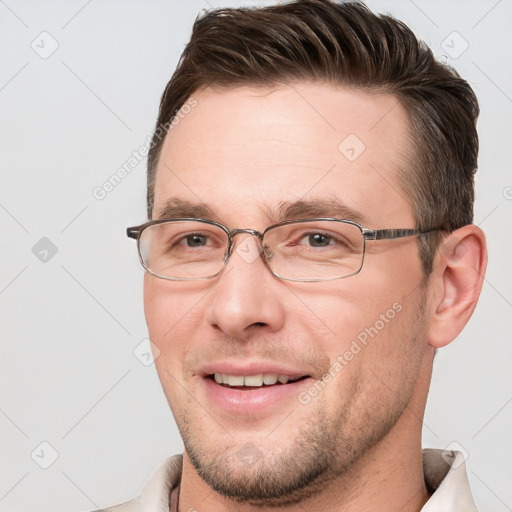 Joyful white adult male with short  brown hair and brown eyes