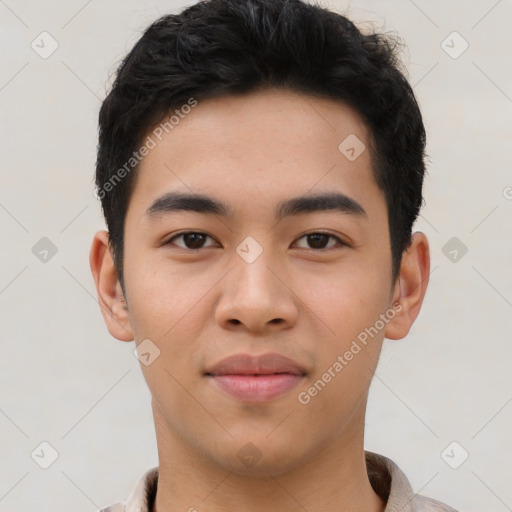 Joyful asian young-adult male with short  brown hair and brown eyes