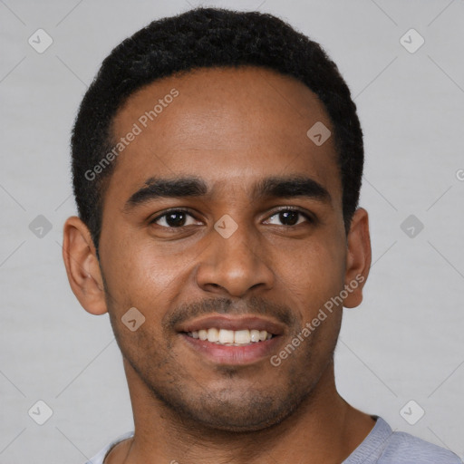 Joyful black young-adult male with short  black hair and brown eyes