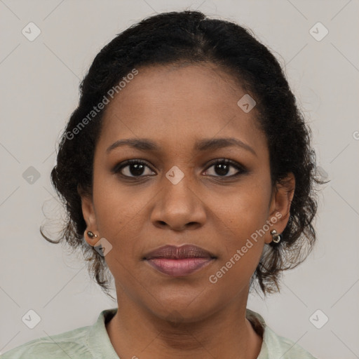 Joyful black young-adult female with medium  brown hair and brown eyes