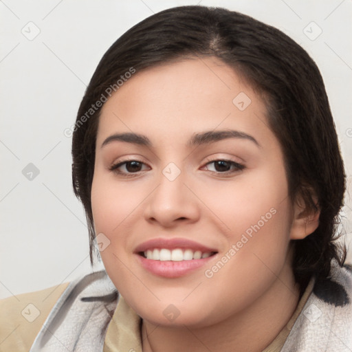 Joyful white young-adult female with medium  black hair and brown eyes