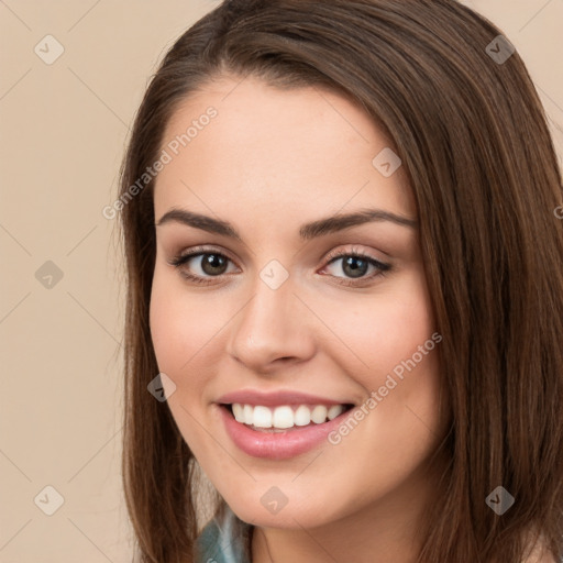 Joyful white young-adult female with long  brown hair and brown eyes