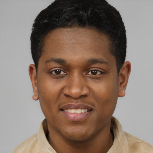 Joyful latino young-adult male with short  brown hair and brown eyes