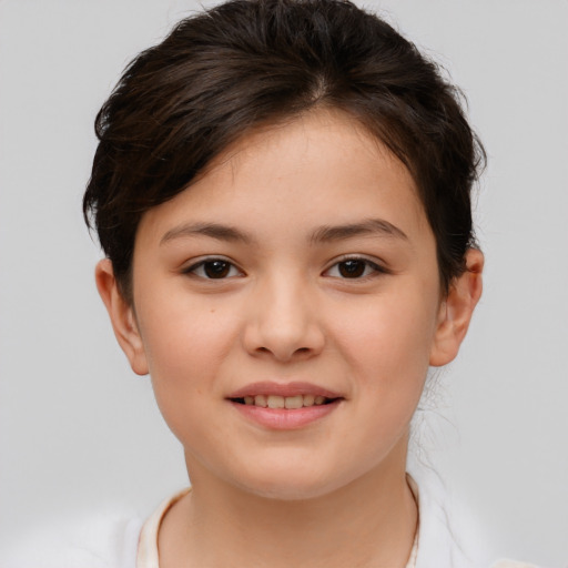 Joyful white child female with short  brown hair and brown eyes