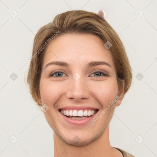 Joyful white young-adult female with short  brown hair and grey eyes